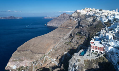 Magically hanging from the cliff of the Caldera, Villa Bordeaux encapsulates the essence of high-end luxury in Fira town. As a precious landmark built by one of the most prestigious personalities back in the day, this luxury villa in Fira was fully renovated in 2016 by a well-known architect, combining the Cycladic tradition with the latest trends in architecture to reach new heights in hospitality.